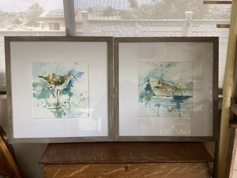 2 matching ocean theme pictures (21” x 21” square) . Driftwood looking frames.