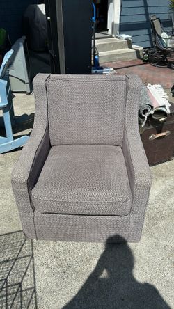 Taupe and grey patterned swivel chair
