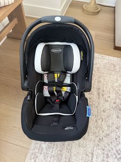 Graco SnugRide SnugFit DLX Infant Car Seat Featuring Safety Surround - Jacks