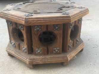 Spanish Colonial Revival style brazier table featuring a distinct octagonal wooden base and metal details.