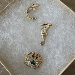 Women’s Jewelry, Three Simulated gold and rhinestone lapel pins/tie tacks.  Dolphin, Crab, and Seahorse
