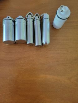 5 metal and 1 plastic screw top pill containers