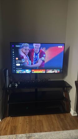 Flat Screen Smart TV with glass stand