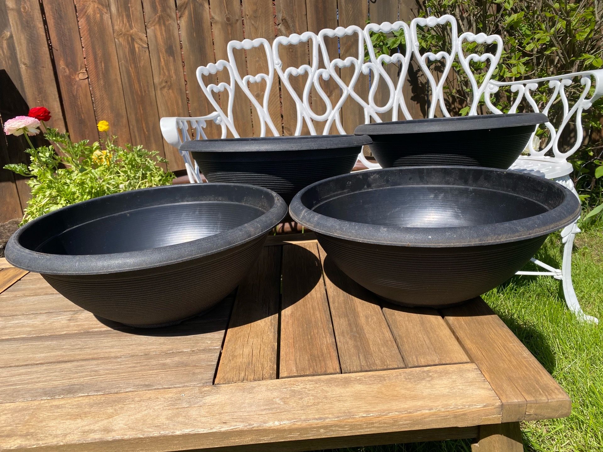 Set of 4 clean round outdoor planter pots all matching, medium size with drainage holes