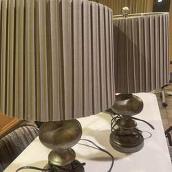 Two pleated table lamps with a metal base