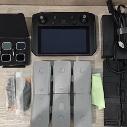 DJI Smart Controller (6) Good Batteries, (2) 3 Bay Battery Chargers, (1) Set Of Spare Blades & New Set Of Lenses.