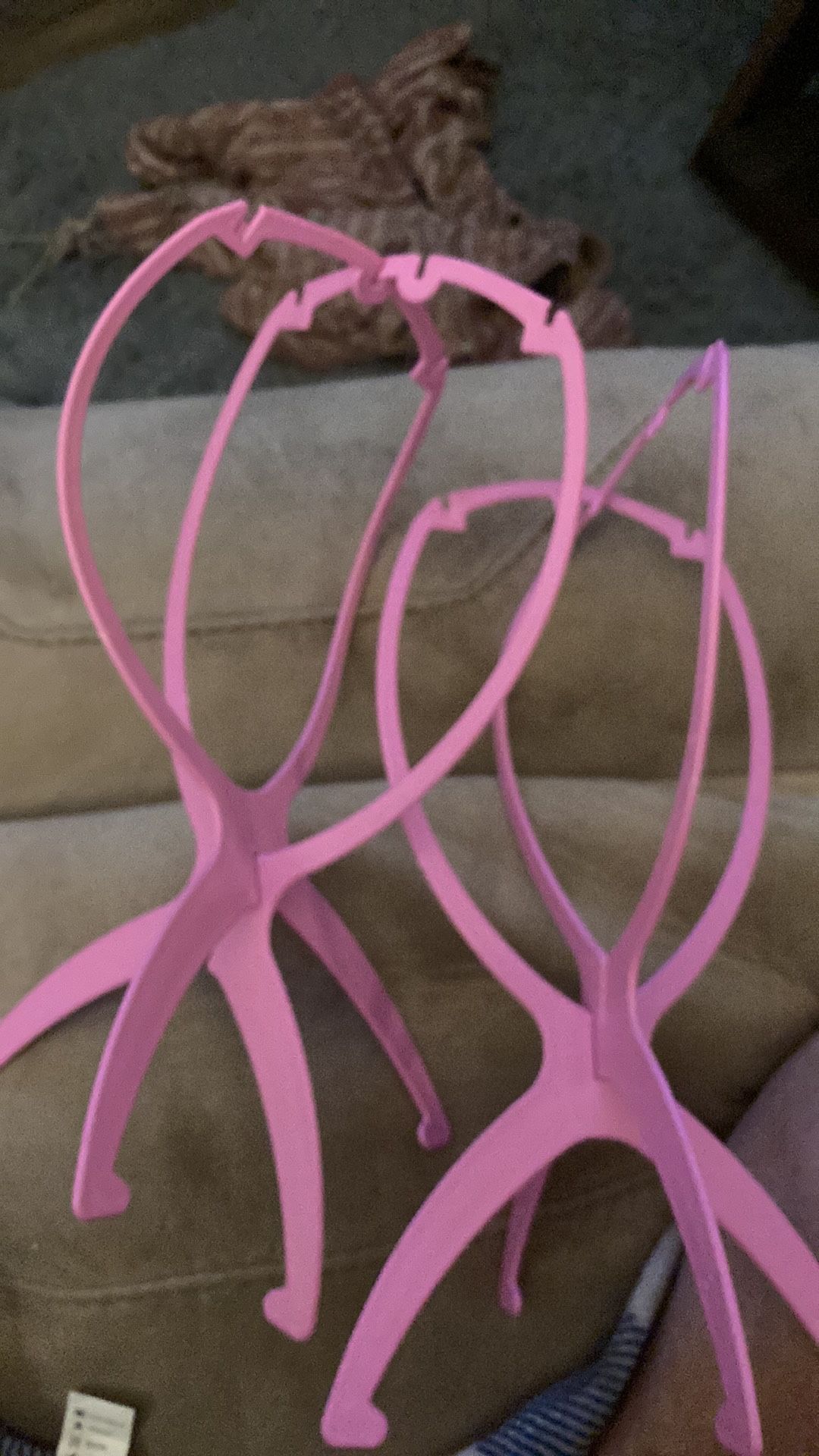 Two plastic wig holders