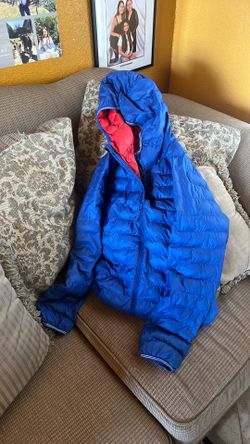 This blue red Uniqlo kids' jacket is size 12