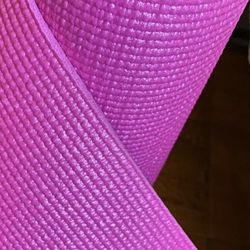 Pink yoga mat with non-slip surface