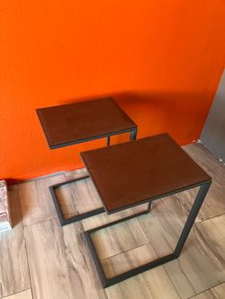 Side tables pair. Leather top. Metal frame.