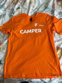 Two brand‑new orange summer camp T‑shirts.