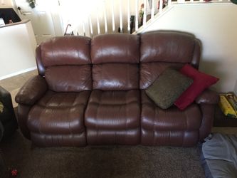 Brown leather couch 7ft with middle fold down drink holder