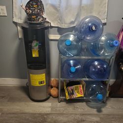 Water Dispensar with the gallons and stand included 