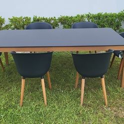 BRAND NEW 84” x 40” Hard Wood Dining Table with Polypropylene All weather Top and (6) Recycled Resin Chairs
