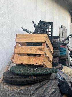 A lot of milk crates and buckets