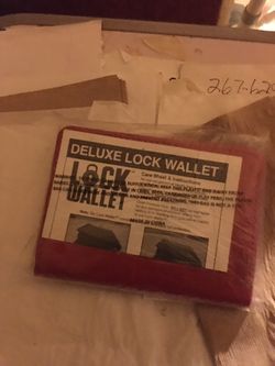BRAND NEW NEVER USED DELUXE LOCK WALLET $20.00