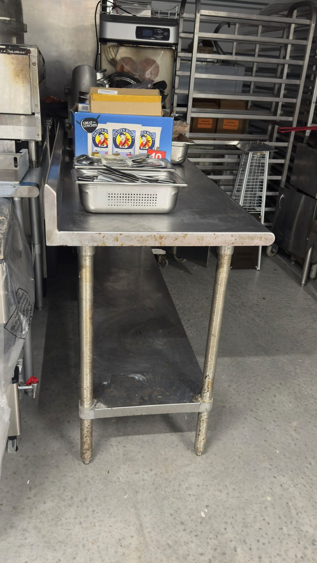 Advance Tabco 24" x 72" 14 Gauge Work Table with Stainless Steel Undershelf and 5" Backsplash $250