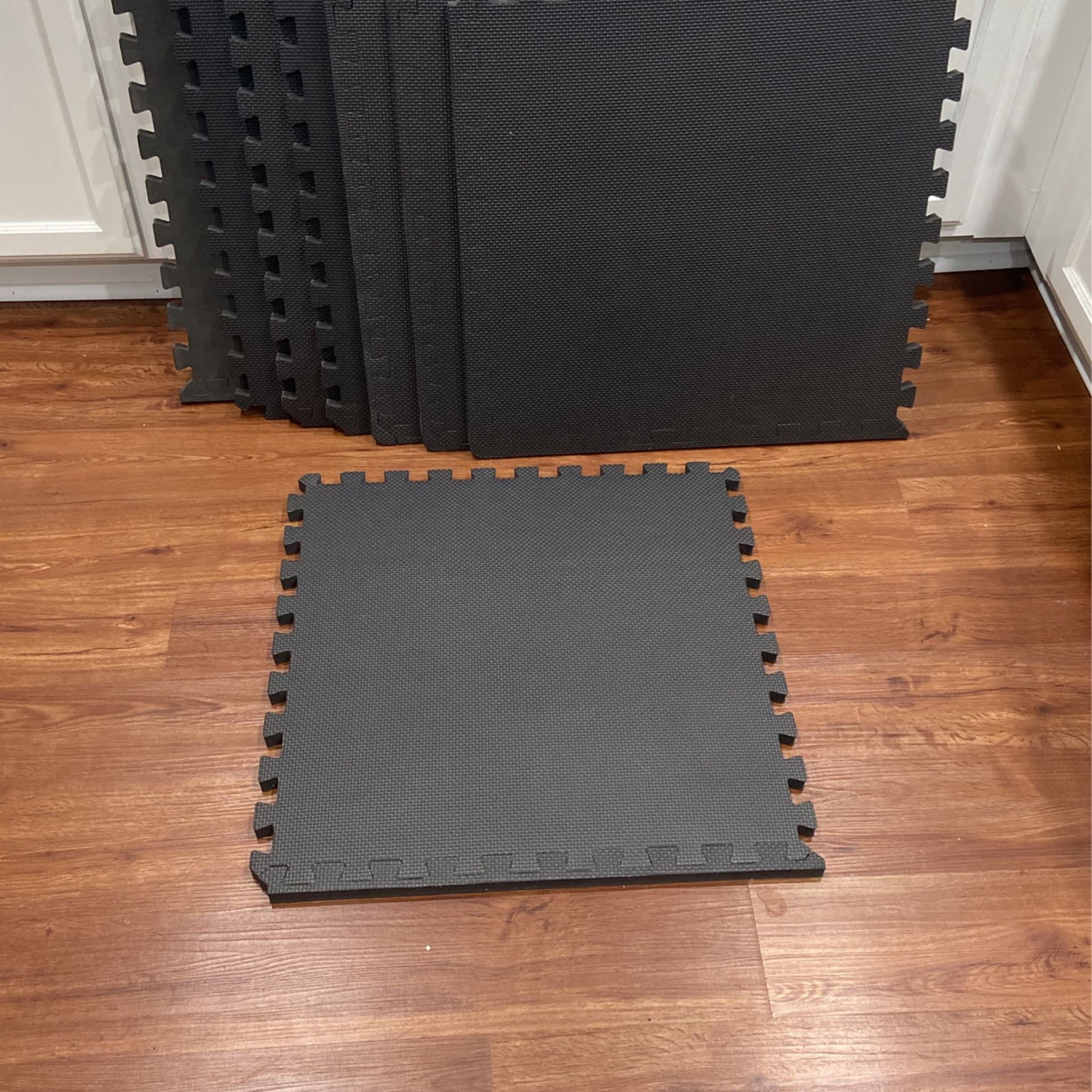 18   24 1/2” X 24 1/2” X 3/4” Rubber Interlocking Floor Tiles. $20.00