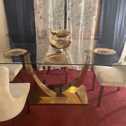 Glass dining room table with six chairs
