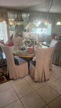 Wooden table with glass top and 4 chairs
