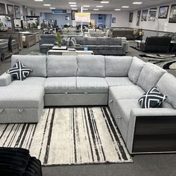 Gray sectional couch with pullout bed