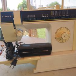 2 Singer Sewing Machines