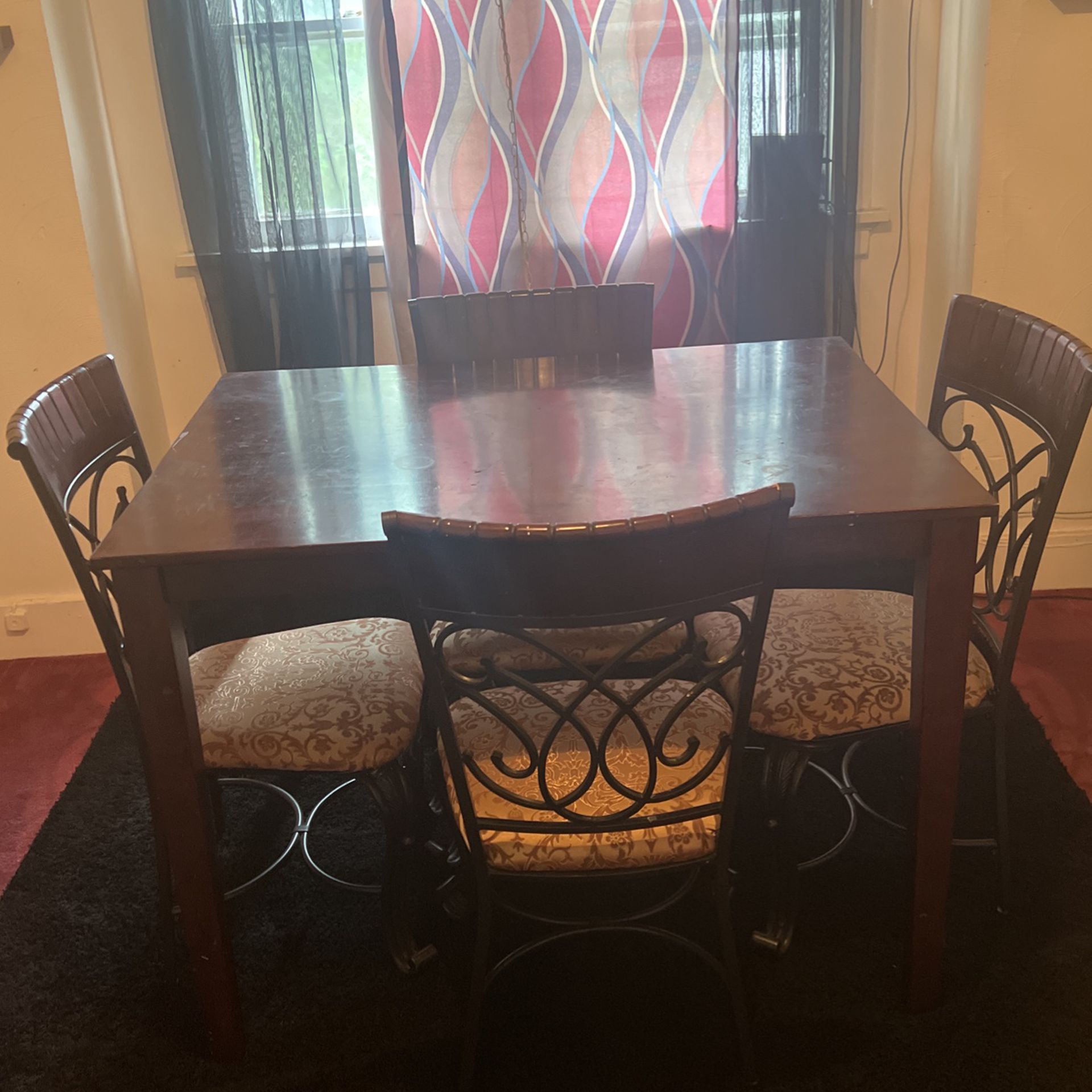 Brown wood table and 4 chairs