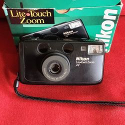  Nikon Zoom 300 AF Nikon Lite Touch point-and-shoot 35mm film camera in its original box. 
 35-70 mm film camera with built-in flash and 