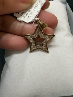Gold star pendant