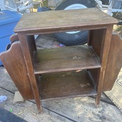 Old magazine rack, needs a good cleaning. It’s 24 inches tall 26 inches wide and 12 inches deep