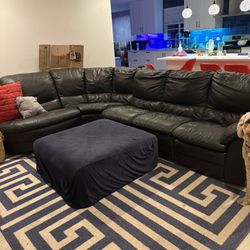 Black leather Sectional Couch With Connected Recliner 