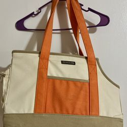 New York dog orange and cream colored dog carrier cold orange small/med 