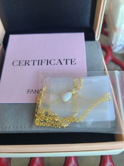 14 k necklace and white opal