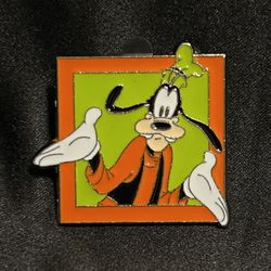 Goofy Shrugging Orange Frame Disney Pin