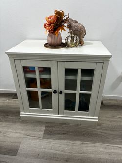 White Wood Cabinet with Glass Door Panels