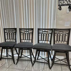 4 Wrought-Iron Swivel Bar Stools
