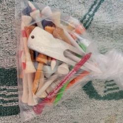 Golf tees various types and sizes, divot tool and ball markers