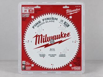 Brand-new Milwaukee 12-inch fine-finish wood-cutting blade, still factory sealed in the original packaging.
