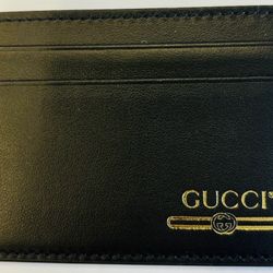 Gucci black and gold card holder