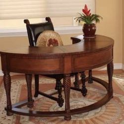 Crescent shaped leather top desk