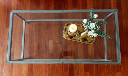 Modern glass coffee table.
Thick tempered glass top