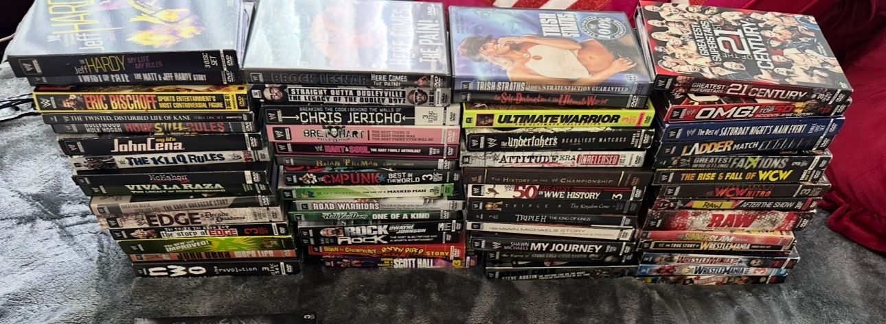 LOT OF 58 WWE DVDS