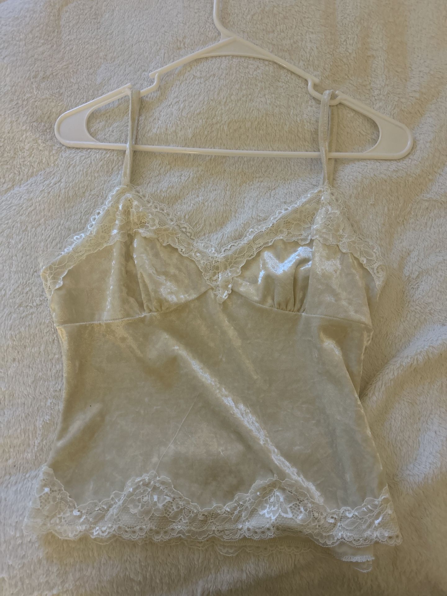 Beige velvet camisole and crocheted halter top with sun designs