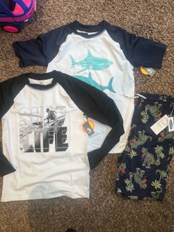 Swim trunk, rash guards size 14/16 new $15- for all.