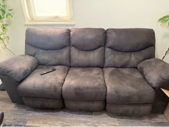 Power reclining sofa in excellent condition with covers included $350