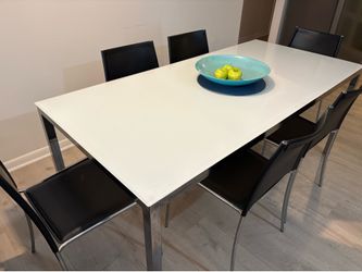 CB2 glass/metal table with six letter chairs