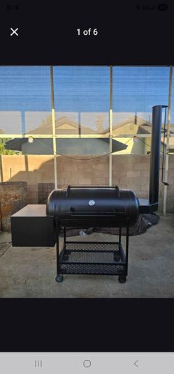 Custom steel smoker with exhaust stack and under-storage rack. Brand new.