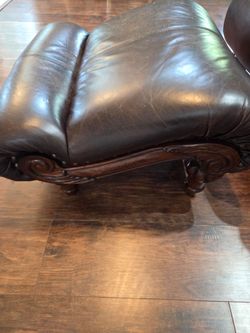 Dark Brown Leather Ottoman with Carved Wood Base