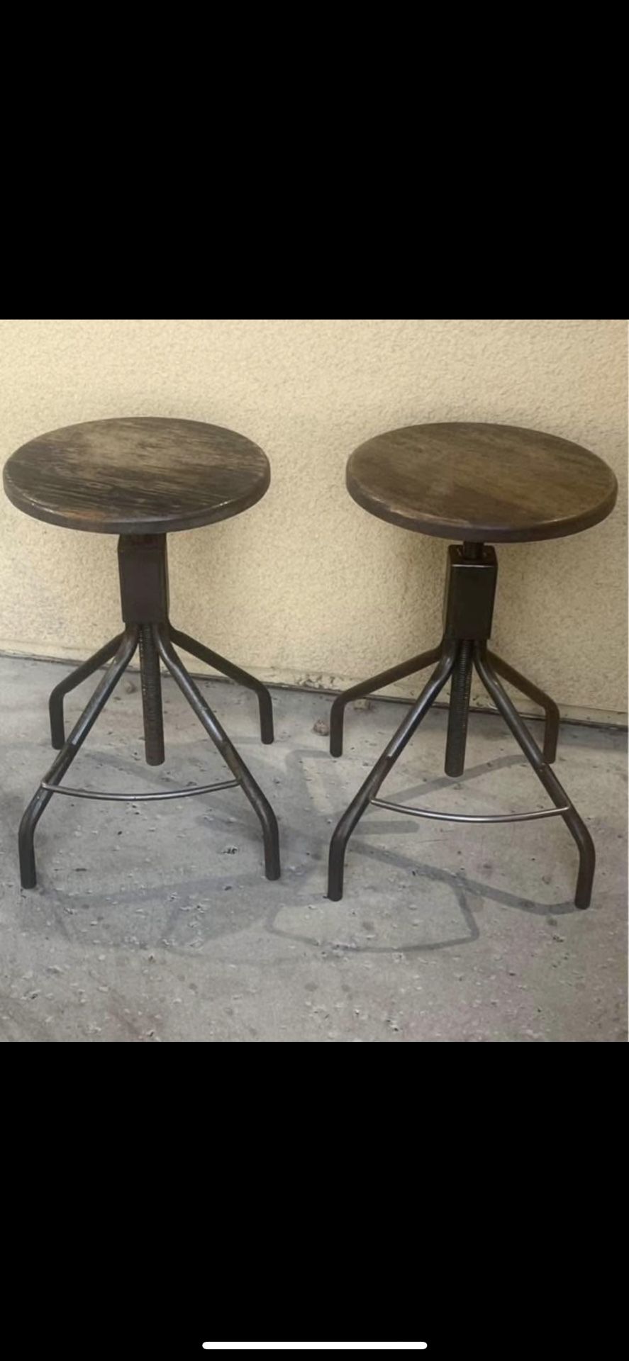 Two wood and iron adjustable height bar stools both for 110