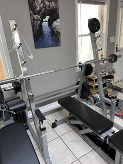 300 lbs INSPIRE Rubber Coated Olympic Weight Set With 7 Foot Bar + Spotting Rack With Bench